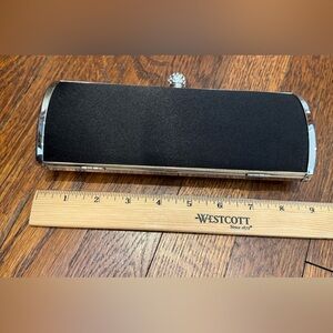 Black and silver clutch with chain to use as a shoulder bag.